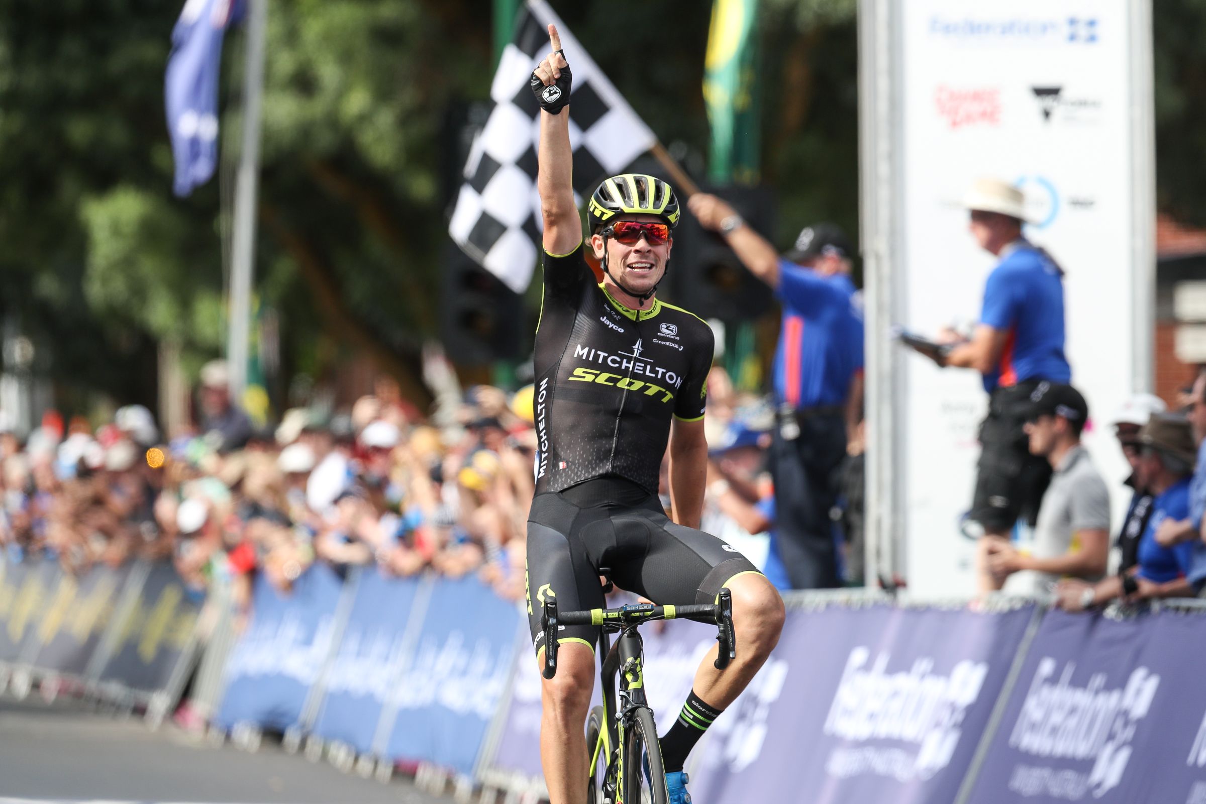 Alex Edmondson celebrates winning across the finish line at the 2018 road race national championships in Buninyong, Ballarat. Con Chronis